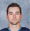 WINNIPEG, MB - SEPTEMBER 12: Neal Pionk #4 of the Winnipeg Jets poses for his official headshot for the 2019-2020 season on September 12, 2019 at the Bell MTS Iceplex in Winnipeg, Manitoba, Canada   (Photo by Jonathan Kozub NHLI via Getty Images) *** Local Caption *** Neal Pionk