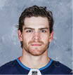 WINNIPEG, MB - SEPTEMBER 12: Adam Lowry #17 of the Winnipeg Jets poses for his official headshot for the 2019-2020 season on September 12, 2019 at the Bell MTS Iceplex in Winnipeg, Manitoba, Canada   (Photo by Jonathan Kozub NHLI via Getty Images) *** Local Caption *** Adam Lowry