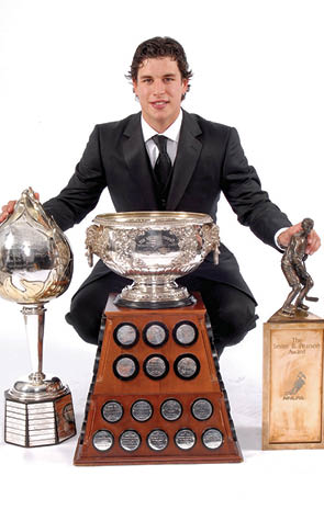 TORONTO, ON - JUNE 14:  Sidney Crosby of the Pittsburgh Penguins poses for a portrait backstage with the Hart Memorial Trophy, the Art Ross Trophy and the Lester B  Pearson Award during the 2007 NHL Awards at the Elgin Theatre on June 14, 2007 in Toronto, Ontario   (Photo by Graig Abel Getty Images for NHL)