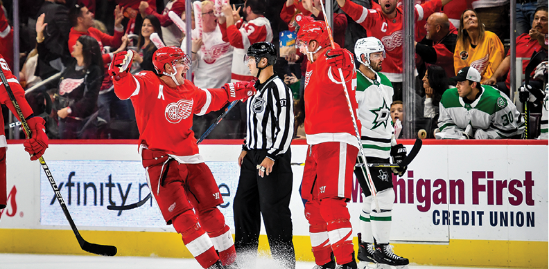 DETROIT, MI - OCTOBER 06: Detroit Red Wings right wing Anthony Mantha (39) celebrates his fourth goal of the game with Detroit Red Wings center Dylan Larkin (71) to go ahead 4-3 during the Detroit Red Wings game versus the Dallas Stars on October 6, 2019, at Little Caesars Arena in Detroit, Michigan  (Photo by Steven King Icon Sportswire via Getty Images)