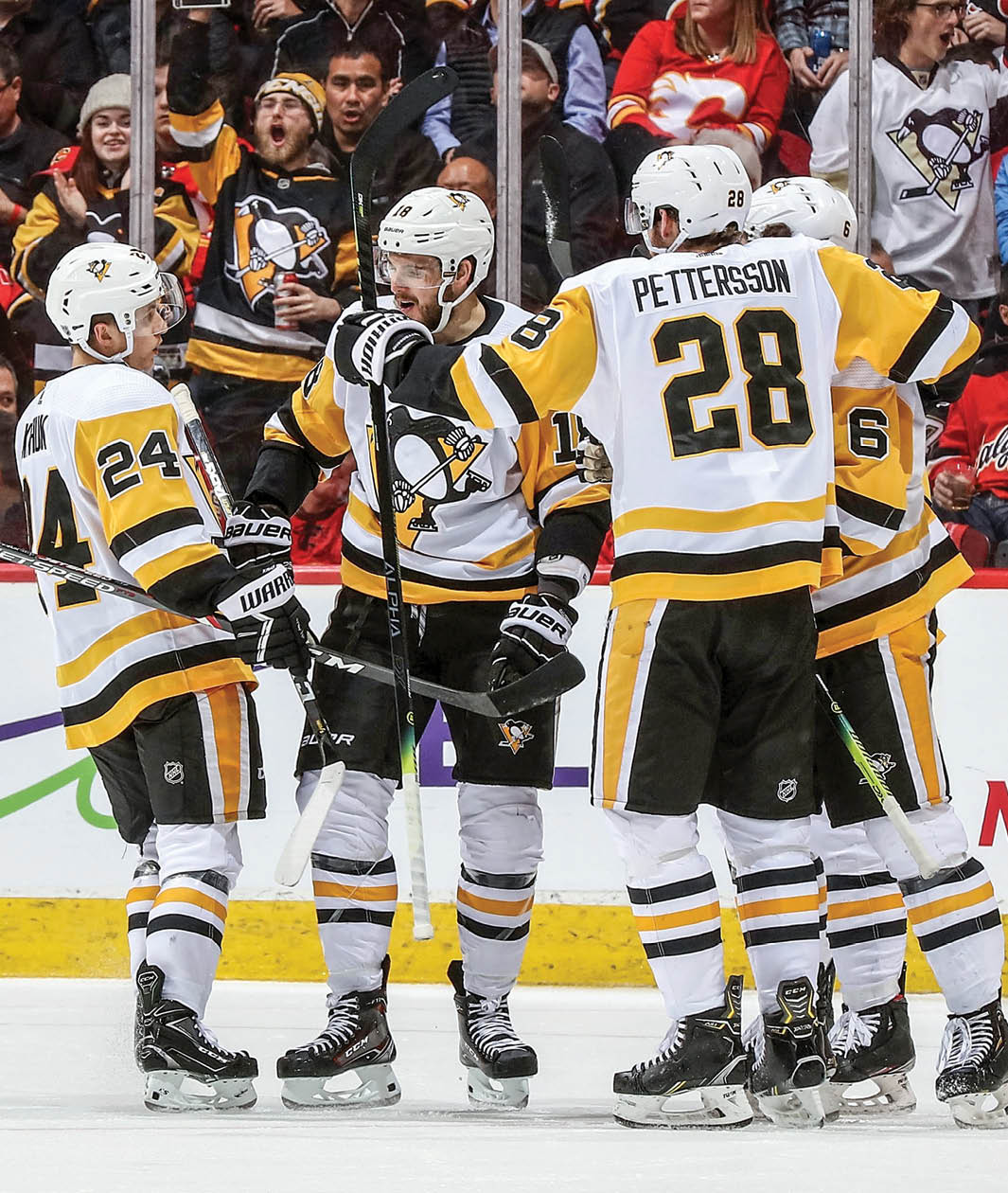 CALGARY, AB - DECEMBER 17: Alex Galchenyuk #18, Dominik Kahun #24, Marcus Pettersson #28 and John Marino #6 of the Pittsburgh Penguins celebrate a goal against the Calgary Flames on December 17, 2019 at the Scotiabank Saddledome in Calgary, Alberta, Canada  (Photo by Gerry Thomas NHLI via Getty Images)