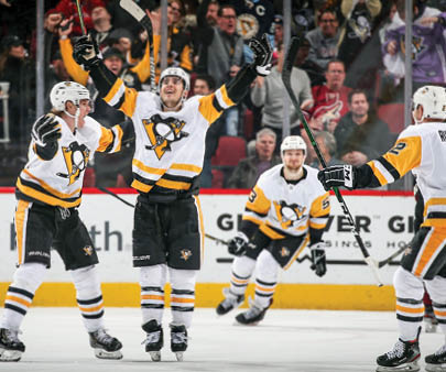GLENDALE, ARIZONA - JANUARY 12: (L-R) Juuso Riikola #50, Brandon Tanev #13, Teddy Blueger #53 and Chad Ruhwedel #2 of the Pittsburgh Penguins celebrate after Tanev scored a goal against the Arizona Coyotes during the third period of the NHL game at Gila River Arena on January 12, 2020 in Glendale, Arizona  The Penguins defeated the Coyotes 4-3 in an overtime shootout  (Photo by Christian Petersen Getty Images)