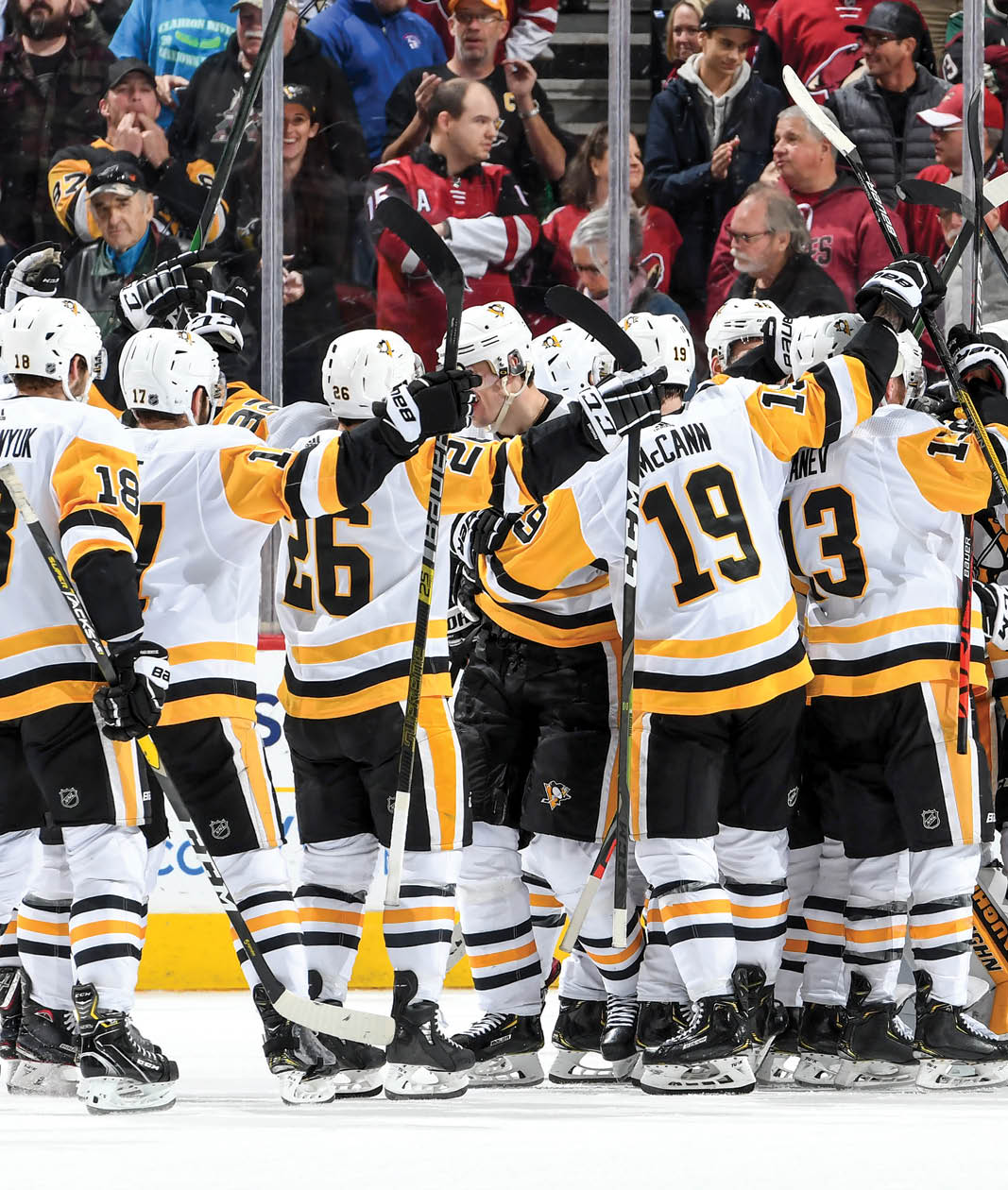 GLENDALE, ARIZONA - JANUARY 12: Goalie Tristian Jarry #35 of the Pittsburgh Penguins is surrounded by teammates as they celebrate a 4-3 shootout victory against the Arizona Coyotes during the NHL hockey game at Gila River Arena on January 12, 2020 in Glendale, Arizona  (Photo by Norm Hall NHLI via Getty Images)