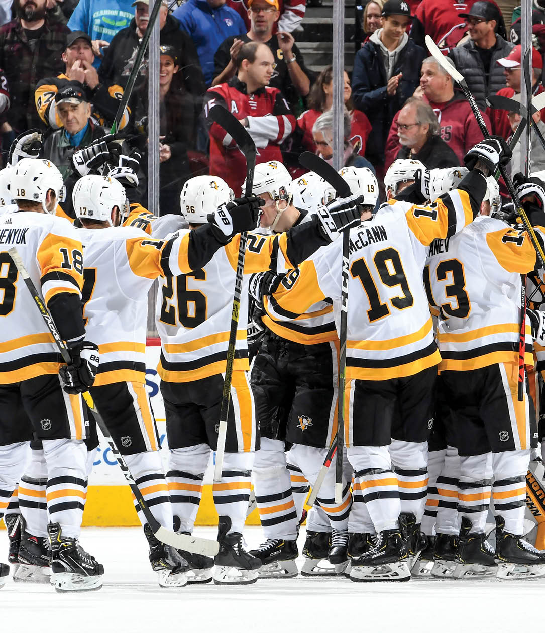 GLENDALE, ARIZONA - JANUARY 12: Goalie Tristian Jarry #35 of the Pittsburgh Penguins is surrounded by teammates as they celebrate a 4-3 shootout victory against the Arizona Coyotes during the NHL hockey game at Gila River Arena on January 12, 2020 in Glendale, Arizona  (Photo by Norm Hall NHLI via Getty Images)