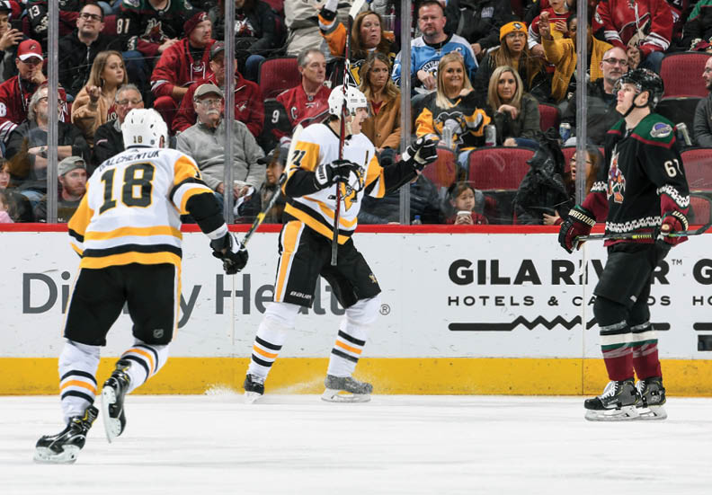GLENDALE, ARIZONA - JANUARY 12: Evgeni Malkin #71 of the Pittsburgh Penguins celebrates after a goal against the Arizona Coyotes at Gila River Arena on January 12, 2020 in Glendale, Arizona  (Photo by Norm Hall NHLI via Getty Images)