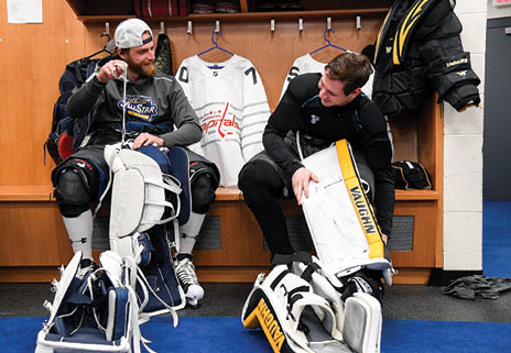 ST LOUIS, MISSOURI - JANUARY 25: Braden Holtby #70 of the Washington Capitals and Tristan Jarry #35 of the Pittsburgh Penguins get dressed before the start of the 2020 NHL All-Star Game at the Enterprise Center on January 25, 2020 in St Louis, Missouri  (Photo by Brian Babineau NHLI via Getty Images)