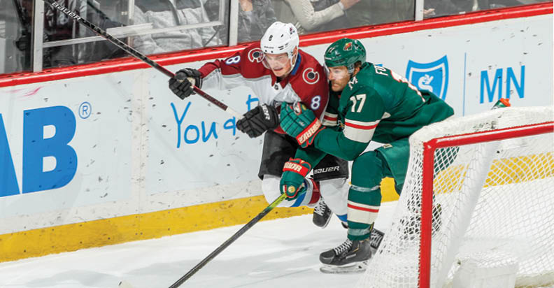SAINT PAUL, MN - FEBRUARY 9: Cale Makar #8 of the Colorado Avalanche and Marcus Foligno #17 of the Minnesota Wild skate to the puck during the game at the Xcel Energy Center on February 9, 2020 in Saint Paul, Minnesota  (Photo by Bruce Kluckhohn NHLI via Getty Images)