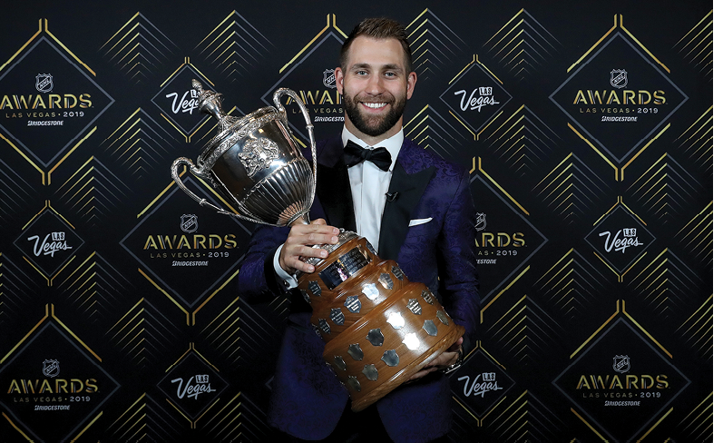 LAS VEGAS, NEVADA - JUNE 19: Jason Zucker of the Minnesota Wild poses with the King Clancy Memorial Trophy given to player who best exemplifies leadership qualities on and off the ice and has made a noteworthy humanitarian contribution in his community during the 2019 NHL Awards at the Mandalay Bay Events Center on June 19, 2019 in Las Vegas, Nevada  (Photo by Bruce Bennett Getty Images)