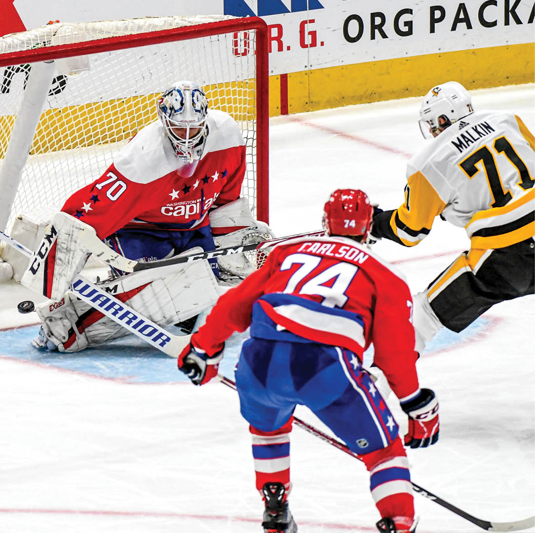 WASHINGTON, DC - FEBRUARY 23: Pittsburgh Penguins center Evgeni Malkin (71) scores in the third period against Washington Capitals goaltender Braden Holtby (70) on February 23, 2020 at the Capital One Arena in Washington, D C   (Photo by Mark Goldman Icon Sportswire via Getty Images)