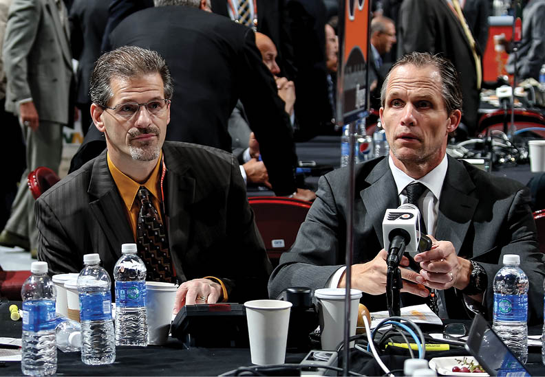 PHILADELPHIA, PA - JUNE 28:  Chris Pryor, Director of Scouting (R), and Ron Hextall General Manager of the Philadelphia Flyers (L) sit at their team table on Day Two of the 2014 NHL Draft at the Wells Fargo Center on June 28, 2014 in Philadelphia, Pennsylvania   (Photo by Bruce Bennett Getty Images)