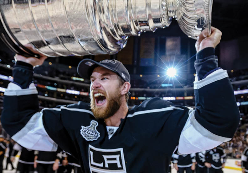LOS ANGELES, CA - JUNE 11:  Jeff Carter #77 of the Los Angeles Kings holds up the Stanley Cup after the Kings defeated the New Jersey Devils 6-1 to win the Stanley Cup series 4-2 in Game Six of the 2012 Stanley Cup Final at Staples Center on June 11, 2012 in Los Angeles, California   (Photo by Bruce Bennett Getty Images) 