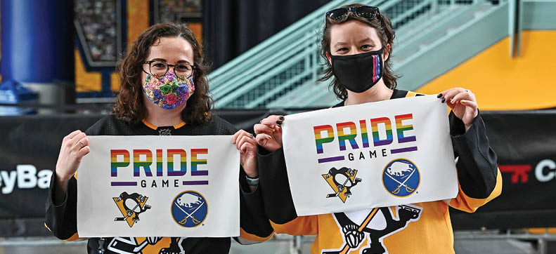 BUFFALO, NY - APRIL 17: Pittsburgh Penguins fans display Pride towels they received entering the first NHL joint Pride Game co-hosted by the Buffalo Sabres and Penguins on April 17, 2021 at KeyBank Center in Buffalo, New York  (Photo by Joe Hrycych NHLI via Getty Images)