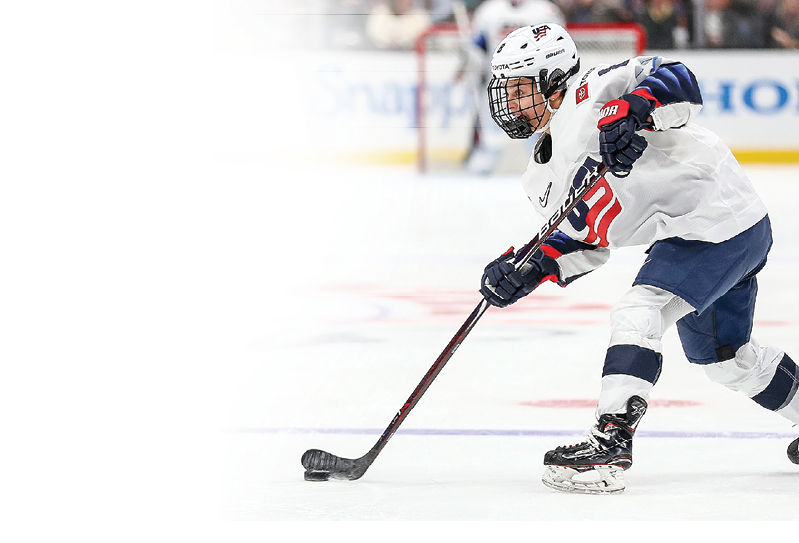 ANAHEIM, CALIFORNIA - FEBRUARY 08: Emily Matheson #8 of the U S  Women's Hockey Team handles the puck in the game against the Canadian Women's National Team at Honda Center on February 08, 2020 in Anaheim, California  (Photo by Meg Oliphant Getty Images)