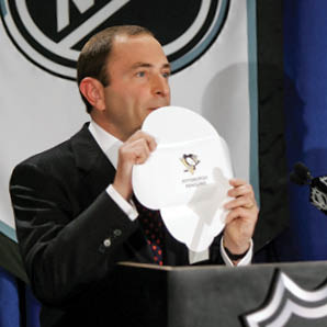 NEW YORK - JULY 22:  Commissioner Gary Bettman of the National Hockey League presents the Pittsburgh Pengiuns card as the first choice in the 2005 entry draft lottery at the Sheraton New York Hotel and Towers July 22, 2005 in New York City   (Photo by Bruce Bennett Getty Images for NHLI)