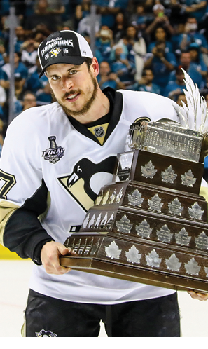 SAN JOSE, CA - JUNE 12:  Sidney Crosby #87 of the Pittsburgh Penguins celebrates with the Conn Smythe Trophy after their 3-1 victory to win the Stanley Cup against the San Jose Sharks in Game Six of the 2016 NHL Stanley Cup Final at SAP Center on June 12, 2016 in San Jose, California   (Photo by Bruce Bennett Getty Images)