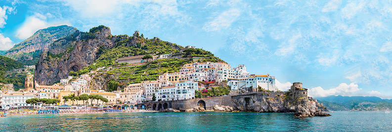 Panoramic view, aerial skyline of small haven of Amalfi village with tiny beach and colorful houses located on rock  Tops of mountains on Amalfi coast, Salerno, Campania, Italy 