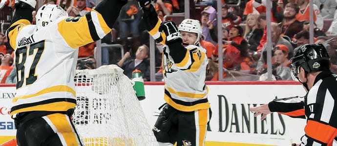 PHILADELPHIA, PA - APRIL 22: Jake Guentzel #59 of the Pittsburgh Penguins celebrates his second period goal against the Philadelphia Flyers with Sidney Crosby #87 in Game Six of the Eastern Conference First Round during the 2018 NHL Stanley Cup Playoffs at the Wells Fargo Center on April 22, 2018 in Philadelphia, Pennsylvania   (Photo by Len Redkoles NHLI via Getty Images)