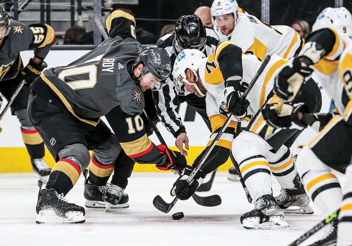 LAS VEGAS, NEVADA - JANUARY 17: Jeff Carter #77 of the Pittsburgh Penguins faces off with Nicolas Roy #10 of the Vegas Golden Knights during the second period at T-Mobile Arena on January 17, 2022 in Las Vegas, Nevada  (Photo by Zak Krill NHLI via Getty Images)