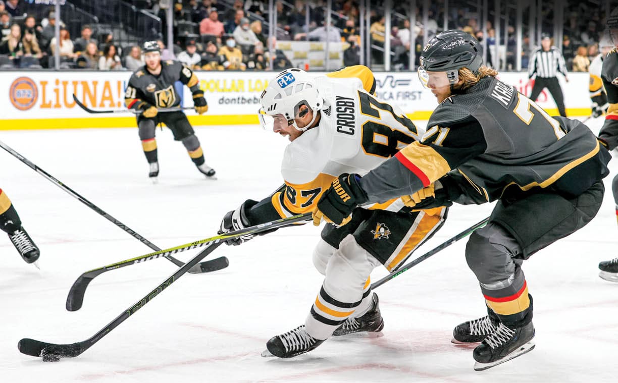 LAS VEGAS, NEVADA - JANUARY 17:  Sidney Crosby #87 of the Pittsburgh Penguins skates with the puck against William Karlsson #71 of the Vegas Golden Knights in the first period of their game at T-Mobile Arena on January 17, 2022 in Las Vegas, Nevada   (Photo by Ethan Miller Getty Images)