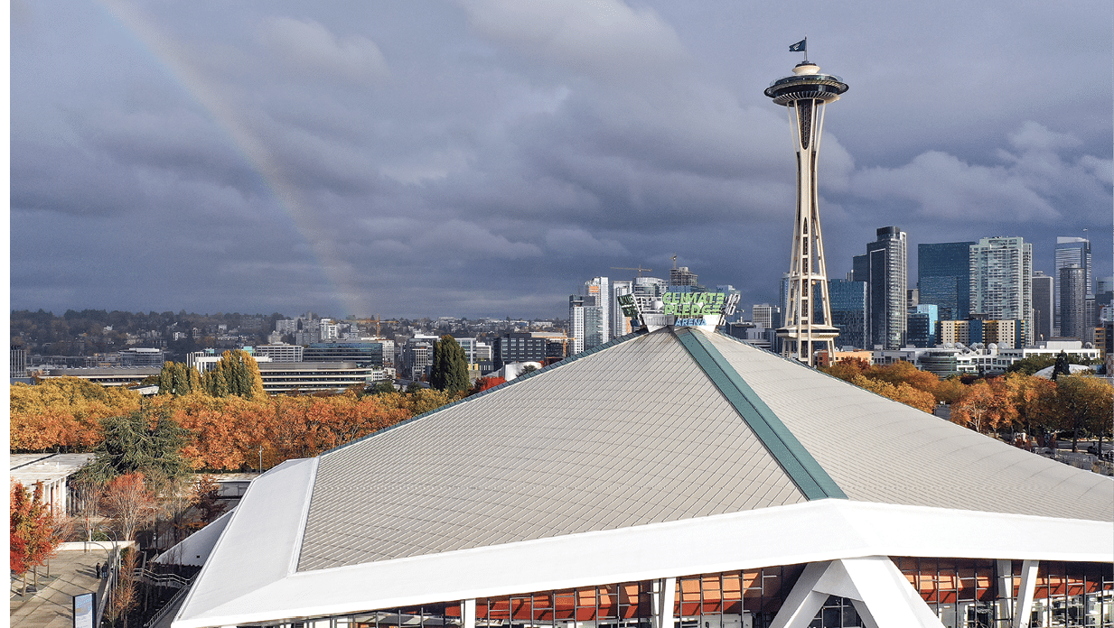 SEATTLE, WASHINGTON - OCTOBER 23: In an aerial view, a  rainbow forms behind the arena prior to the inaugural home game for the Seattle Kraken as they face the Vancouver Canucks at the Climate Pledge Arena on October 23, 2021 in Seattle, Washington  (Photo by Bruce Bennett Getty Images)