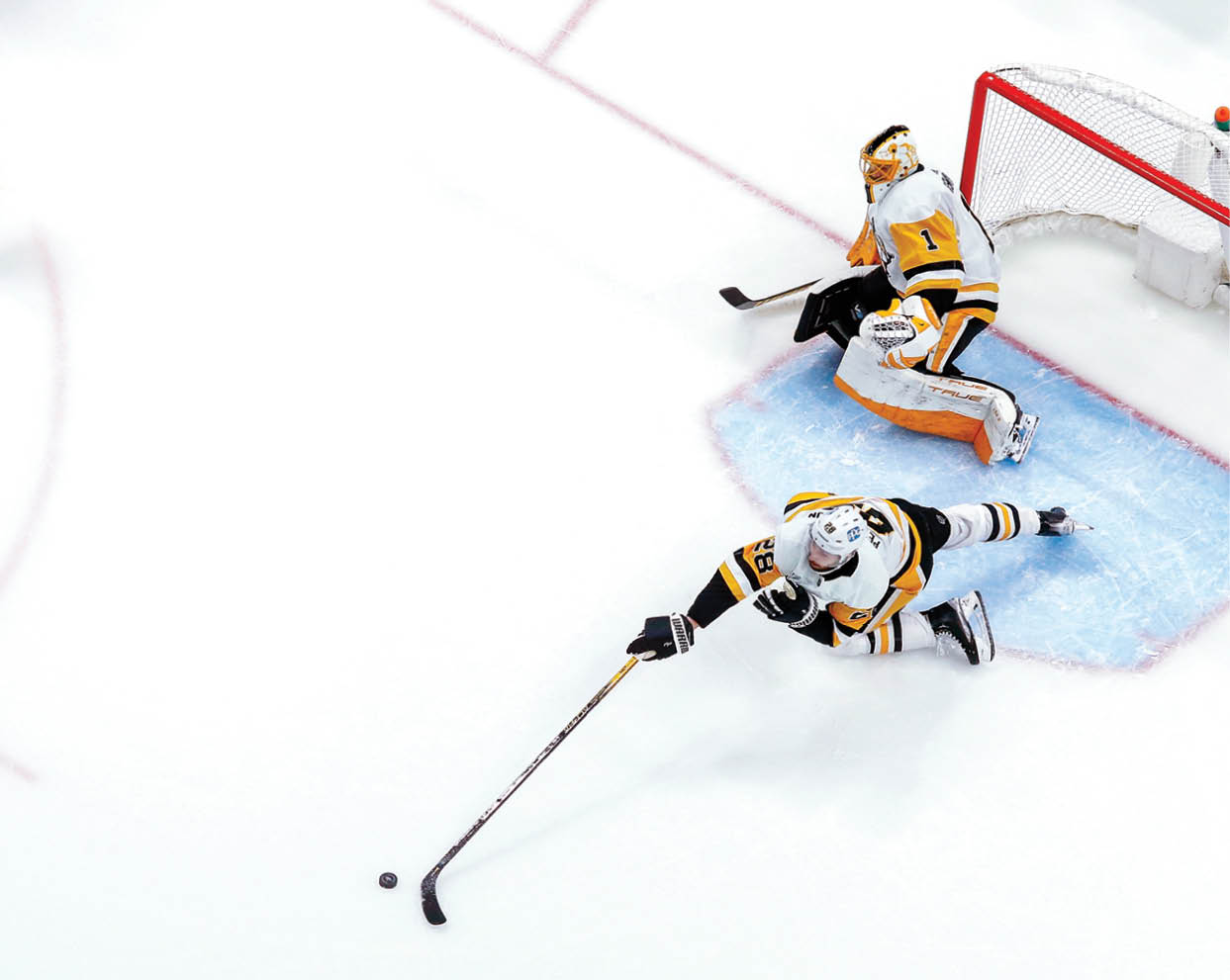 COLUMBUS, OH - FEBRUARY 27:  Marcus Pettersson #28 of the Pittsburgh Penguins knocks away a loose puck during the second period of the game against the Columbus Blue Jackets at Nationwide Arena on February 27, 2022 in Columbus, Ohio  Pittsburgh defeated Columbus 3-2  (Photo by Kirk Irwin Getty Images)