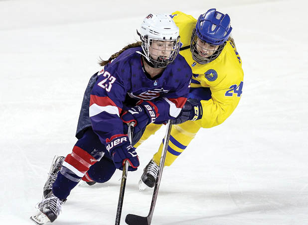 ST  CATHARINES, ON - JANUARY 14:  Taylor Heise #23 of Team USA skates with the puck as Moa Vernblom #24 of Team Sweden chases in a semifinal game during the 2016 IIHF U18 Women's World Championships at the Meridian Centre on January 14, 2016 in St  Catharines, Ontario, Canada   (Photo by Vaughn Ridley Getty Images)