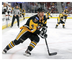 CLEVELAND, OH - JANUARY 28: Wilkes-Barre Scranton Penguins defenceman Taylor Fedun (4) follows the puck into the corner during the third period of the American Hockey League game between the Wilkes-Barre Scranton Penguins and Cleveland Monsters on January 28, 2022, at Rocket Mortgage FieldHouse in Cleveland, OH  (Photo by Frank Jansky Icon Sportswire via Getty Images)