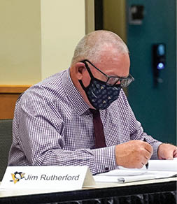 PITTSBURGH, PENNSLYVANIA- OCTOBER 07: General manager Jim Rutherford of the Pittsburgh Penguins sits at the draft table during rounds 2-7 of the 2020 NHL Entry Draft at PPG Paints Arena on October 07, 2020 in Pittsburgh, Pennsylvania  The 2020 NHL Draft was held virtually due to the ongoing Coronavirus pandemic  (Photo by Ryan Yorgen NHLI via Getty Images)