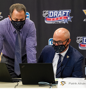 PITTSBURGH, PENNSLYVANIA- OCTOBER 07: Director of Amateur Scouting Patrik Allvin of the Pittsburgh Penguins speaks to assistant general manager Jason Karmanos during rounds 2-7 of the 2020 NHL Entry Draft at PPG Paints Arena on October 07, 2020 in Pittsburgh, Pennsylvania  The 2020 NHL Draft was held virtually due to the ongoing Coronavirus pandemic  (Photo by Ryan Yorgen NHLI via Getty Images)