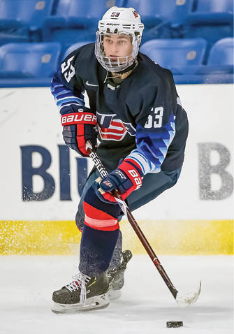 PLYMOUTH, MI - DECEMBER 12: Chase Yoder #53 of the U S  Nationals controls the puck against the Switzerland Nationals during day-2 of game two of the 2018 Under-17 Four Nations Tournament at USA Hockey Arena on December 12, 2018 in Plymouth, Michigan  USA defeated Switzerland 3-1  (Photo by Dave Reginek Getty Images)