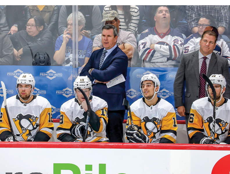 WINNIPEG, MB - OCTOBER 13: Head Coach Mike Sullivan of the Pittsburgh Penguins looks on from the bench during third period action against the Winnipeg Jets at the Bell MTS Place on October 13, 2019 in Winnipeg, Manitoba, Canada  (Photo by Jonathan Kozub NHLI via Getty Images)