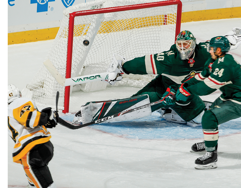 SAINT PAUL, MN - OCTOBER 12: Adam Johnson #47 of the Pittsburgh Penguins scores a goal with Matt Dumba #24 and Devan Dubnyk #40 of the Minnesota Wild defending during the game at the Xcel Energy Center on October 12, 2019 in Saint Paul, MN  (Photo by Bruce Kluckhohn NHLI via Getty Images)