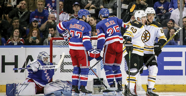 NEW YORK, NEW YORK - OCTOBER 27: Brad Marchand #63 of the Boston Bruins celebrates his goal at 1:08 of the second period against Henrik Lundqvist #30 of the New York Rangers and is joined by David Pastrnak #88 (R) at Madison Square Garden on October 27, 2019 in New York City  (Photo by Bruce Bennett Getty Images)