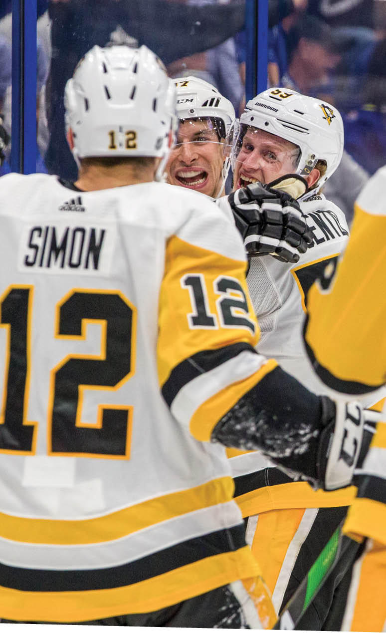 TAMPA, FL - OCTOBER 23: Sidney Crosby #87 of the Pittsburgh Penguins celebrates a goal by teammate Jake Guentzel #59 against the Tampa Bay Lightning during the second period at Amalie Arena on October 23, 2019 in Tampa, Florida   (Photo by Scott Audette  NHLI via Getty Images)