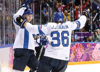 SOCHI, RUSSIA - FEBRUARY 22: Olli Maatta #3 of Finland celebrates his goal with Jussi Jokinen #36 in the third period against the United States during the Men's Ice Hockey Bronze Medal Game on Day 15 of the 2014 Sochi Winter Olympics at Bolshoy Ice Dome on February 22, 2014 in Sochi, Russia   (Photo by Bruce Bennett Getty Images)