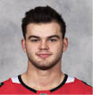 CHICAGO, IL - SEPTEMBER 12:  Alex DeBrincat #12 of the Chicago Blackhawks poses for his official headshot for the 2019-2020 season on September 12, 2019 at the United Center in Chicago, Illinois  (Photo by Chase Agnello-Dean NHLI via Getty Images) *** Local Caption *** Alex DeBrincat