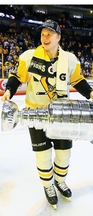 NASHVILLE, TN - JUNE 11:  Olli Maatta #3 of the Pittsburgh Penguins celebrates with the Stanley Cup trophy after defeating the Nashville Predators 2-0 in Game Six of the 2017 NHL Stanley Cup Final at the Bridgestone Arena on June 11, 2017 in Nashville, Tennessee   (Photo by Bruce Bennett Getty Images)