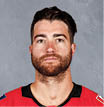 CALGARY, CANADA   SEPTEMBER 12: TJ Brodie of the Calgary Flames poses for his official headshot for the 2019-2020 season on September 12, 2019 at the Scotiabank Saddledome in Calgary, Canada  (Photo by Brad Watson NHLI via Getty Images) *** Local Caption *** TJ Brodie