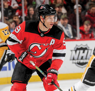 NEWARK, NEW JERSEY - NOVEMBER 15:  Taylor Hall #9 of the New Jersey Devils takes the puck in the second period against the Pittsburgh Penguins at Prudential Center on November 15, 2019 in Newark, New Jersey  (Photo by Elsa Getty Images)