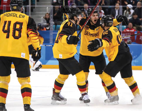 GANGNEUNG, SOUTH KOREA - FEBRUARY 25:  Dominik Kahun #72 of Germany celebrates with Jonas Muller #41 and Yasin Ehliz #42 after scoring a goal in the third period against Olympic Athletes from Russia during the Men's Gold Medal Game on day sixteen of the PyeongChang 2018 Winter Olympic Games at Gangneung Hockey Centre on February 25, 2018 in Gangneung, South Korea   (Photo by Bruce Bennett Getty Images)