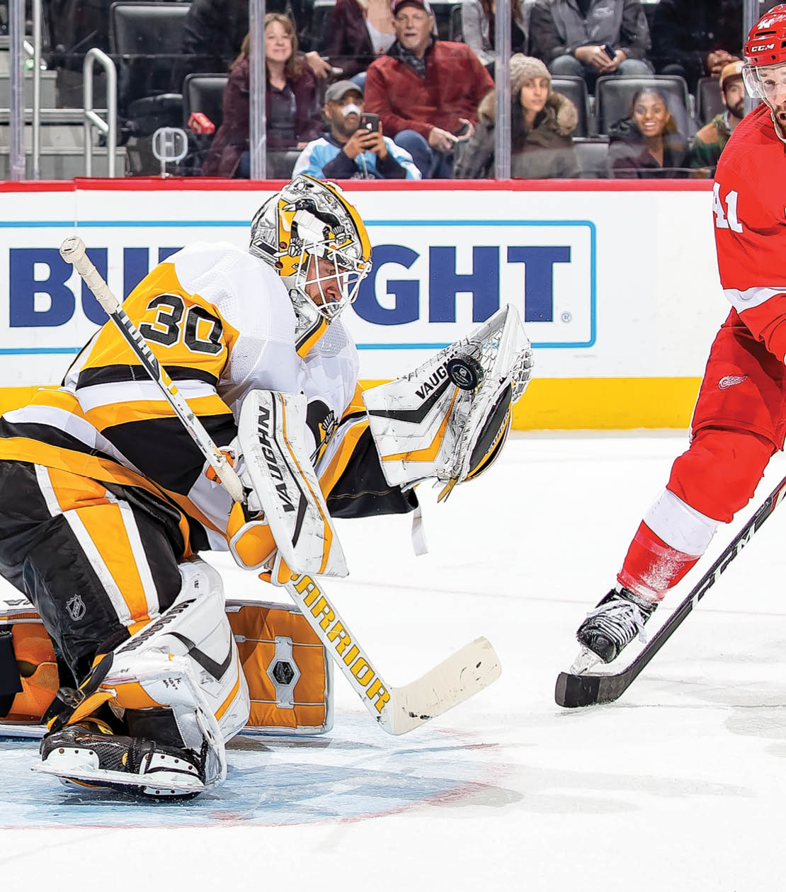 DETROIT, MI - DECEMBER 07: Luke Glendening #41 of the Detroit Red Wings looks for the rebound on a glove save by Matt Murray #30 of the Pittsburgh Penguins during an NHL game at Little Caesars Arena on December 7, 2019 in Detroit, Michigan  The Penguins defeated the Wings 5-3  (Photo by Dave Reginek NHLI via Getty Images)