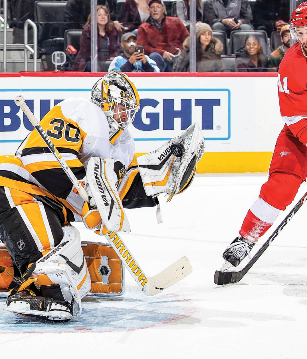 DETROIT, MI - DECEMBER 07: Luke Glendening #41 of the Detroit Red Wings looks for the rebound on a glove save by Matt Murray #30 of the Pittsburgh Penguins during an NHL game at Little Caesars Arena on December 7, 2019 in Detroit, Michigan  The Penguins defeated the Wings 5-3  (Photo by Dave Reginek NHLI via Getty Images)