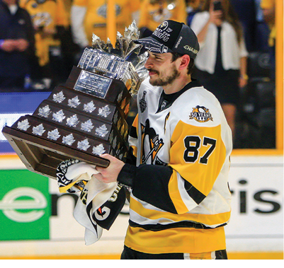 NASHVILLE, TN - JUNE 11: Pittsburgh Penguins center Sidney Crosby (87) is shown with the Conn Smythe Trophy following Game 6 of the Stanley Cup Final between the Nashville Predators and the Pittsburgh Penguins, held on June 11, 2017, at Bridgestone Arena in Nashville, Tennessee  (Photo by Danny Murphy Icon Sportswire via Getty Images)