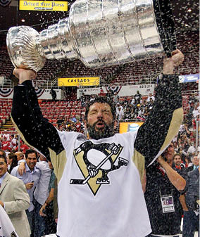 DETROIT - JUNE 12:  Bill Guerin #13 of the Pittsburgh Penguins celebrates with the Stanley Cup after defeating the Detroit Red Wings by a score of 2-1 to win Game Seven and the 2009 NHL Stanley Cup Finals at Joe Louis Arena on June 12, 2009 in Detroit, Michigan   (Photo by Jim McIsaac Getty Images)