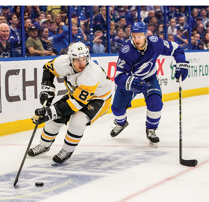 TAMPA, FL - OCTOBER 23: Kevin Shattenkirk #22 of the Tampa Bay Lightning battles for the puck against Sidney Crosby #87 of the Pittsburgh Penguins during the second period at Amalie Arena on October 23, 2019 in Tampa, Florida   (Photo by Scott Audette  NHLI via Getty Images)